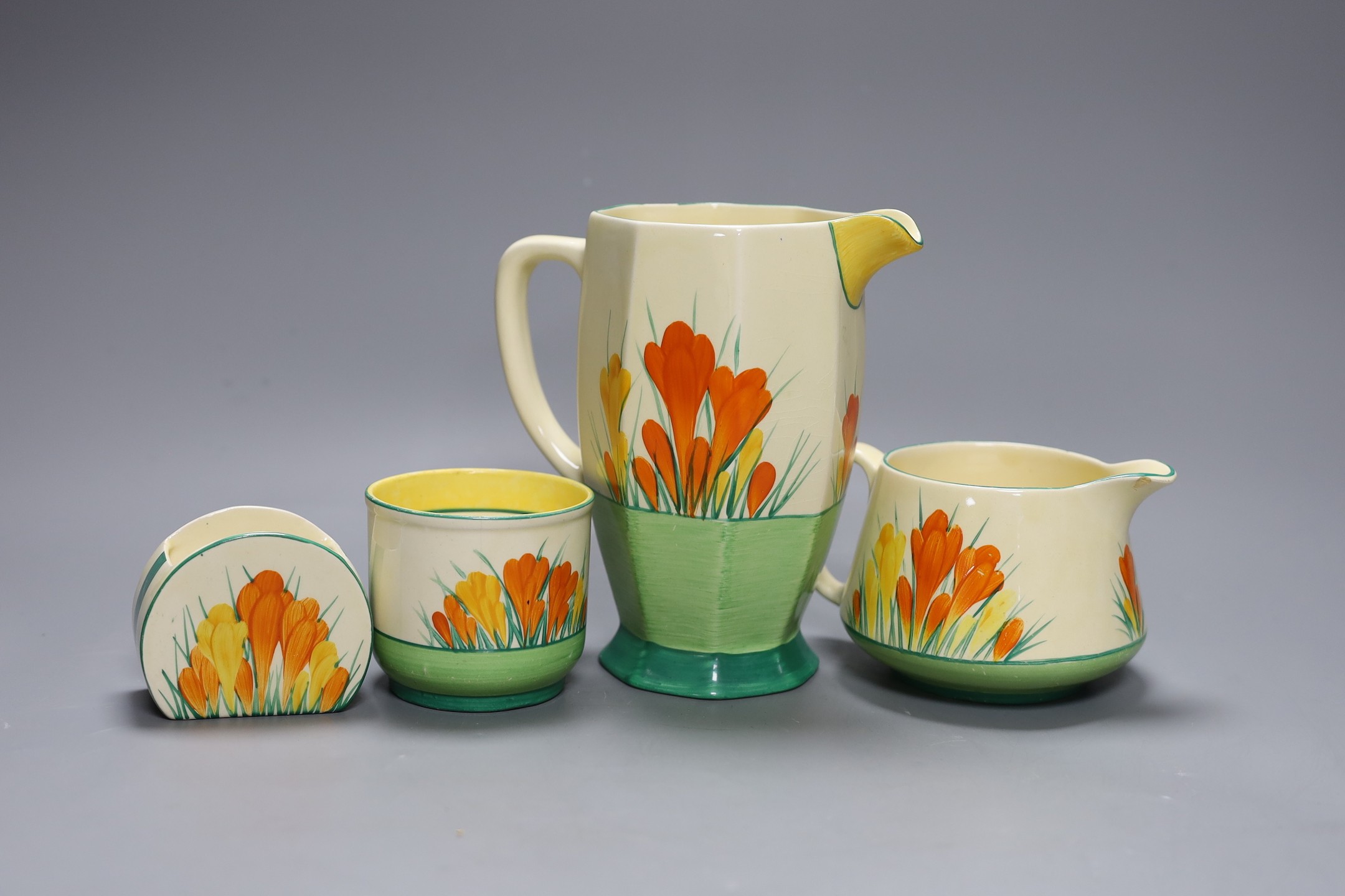 Two Clarice cliff “Sungleam”, crocus jugs and two pots, (4), tallest jug 17 cms high